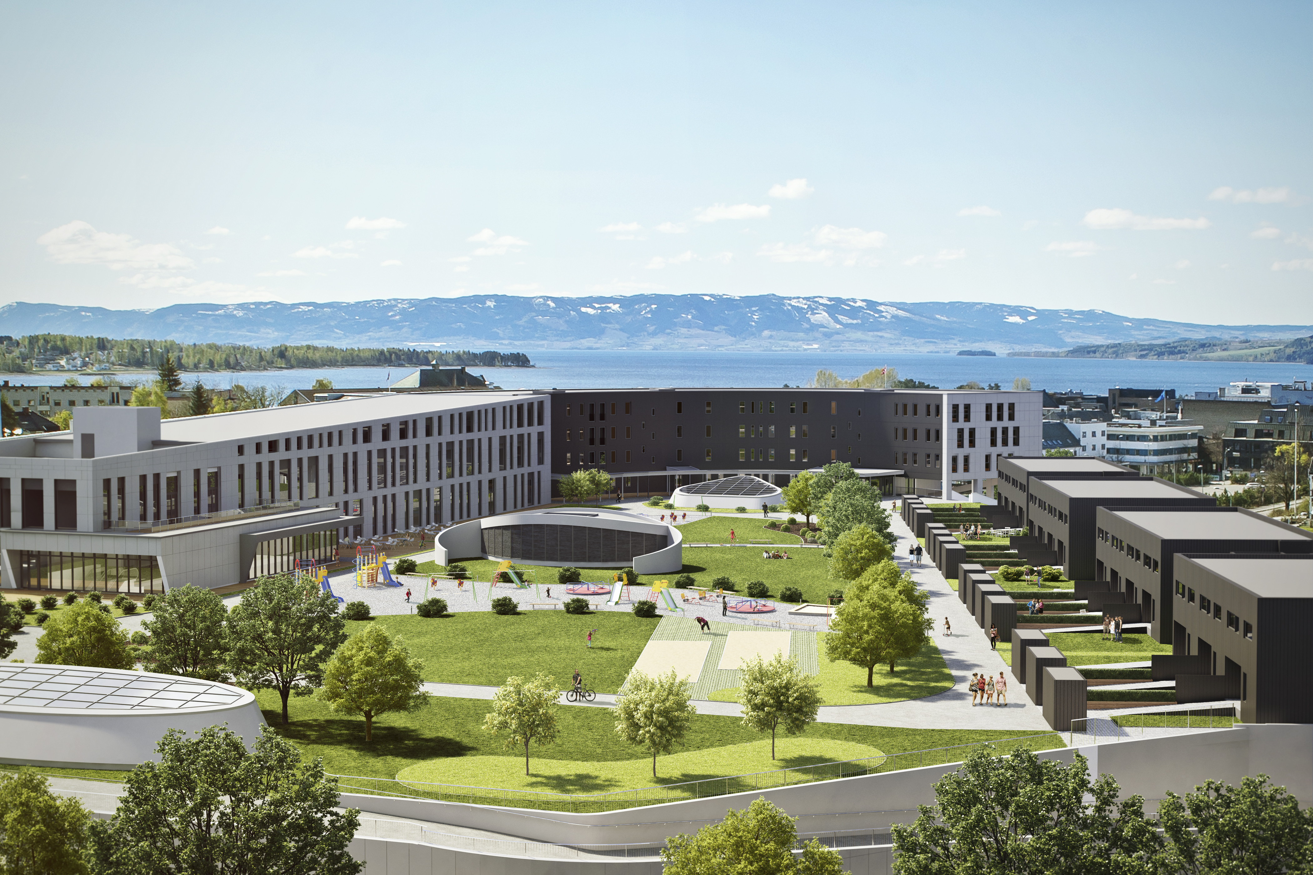 en kunstners gjengivelse av et campus med en innsjø i bakgrunnen.