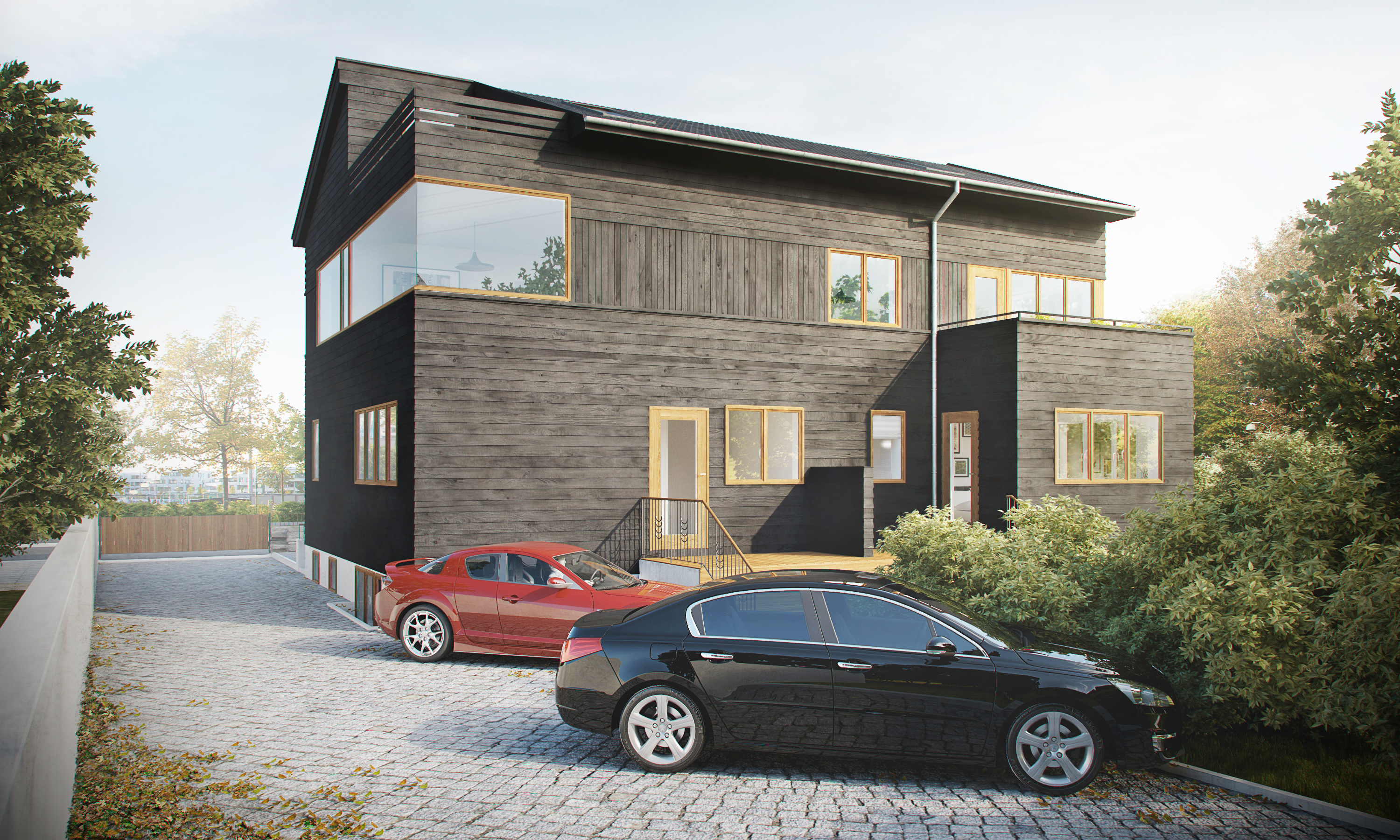 et hus med to biler parkert foran.