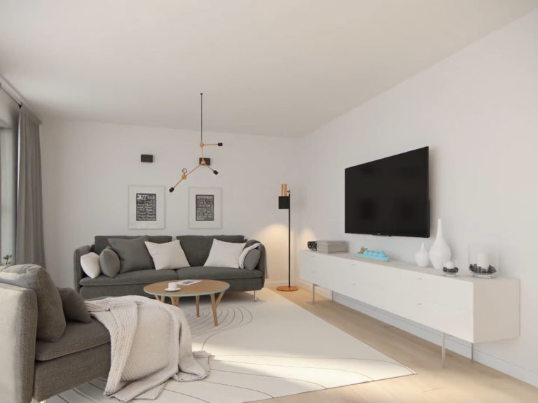 En hvit sofa og TV i en stue for å visualisere salg i 2016.