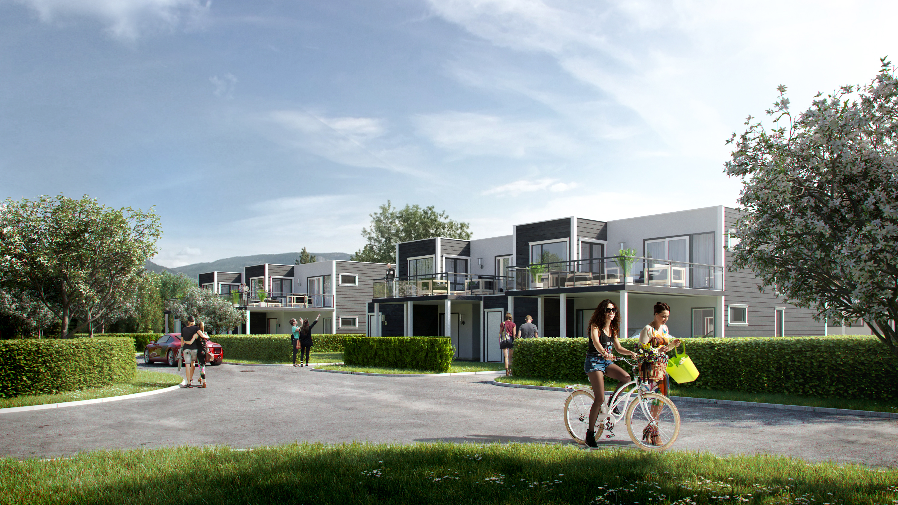 En gruppe mennesker som sykler foran en bygning, visualisert for salgsformål i 2016.