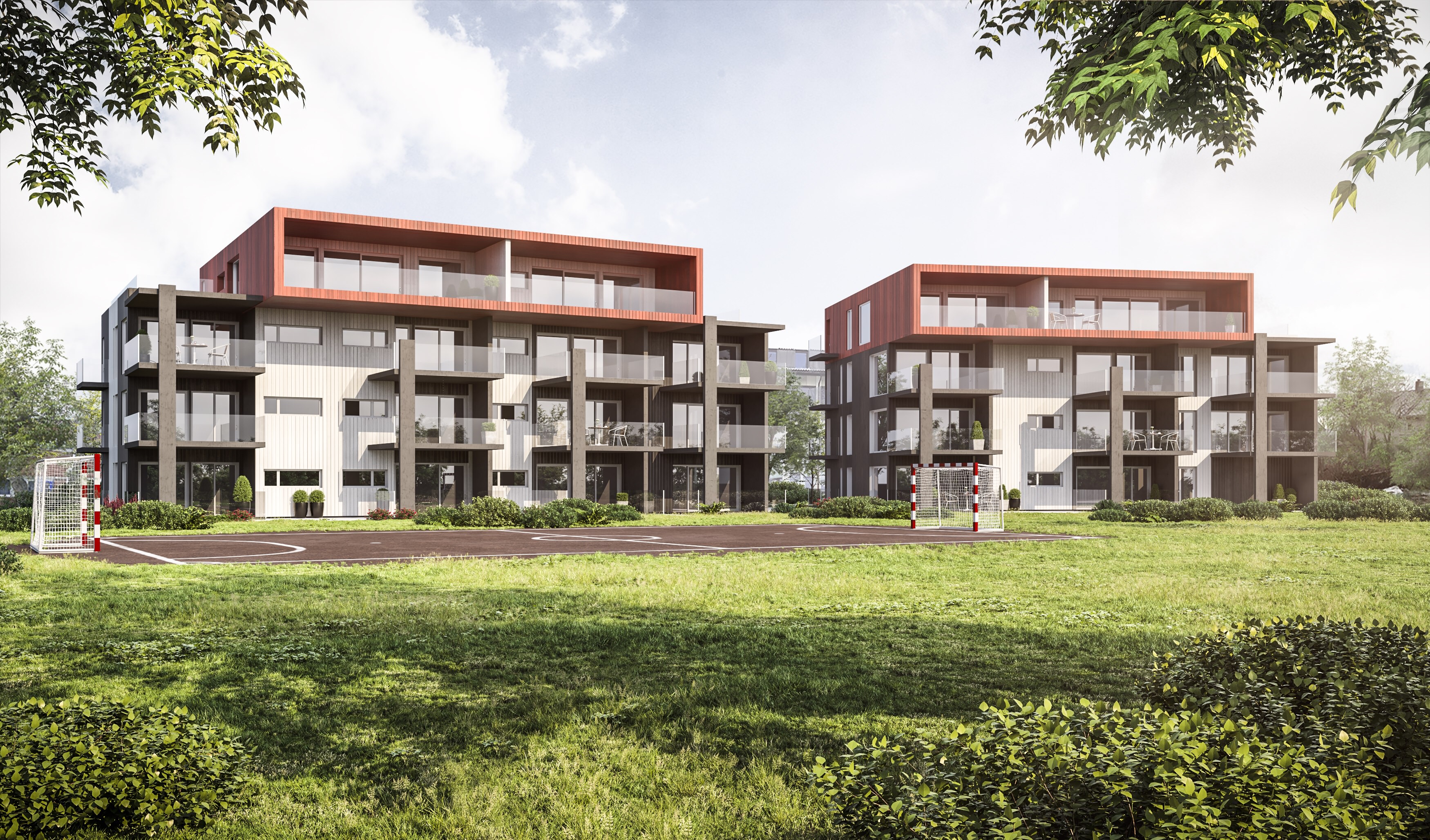 To leilighetsbygg i et gressområde.