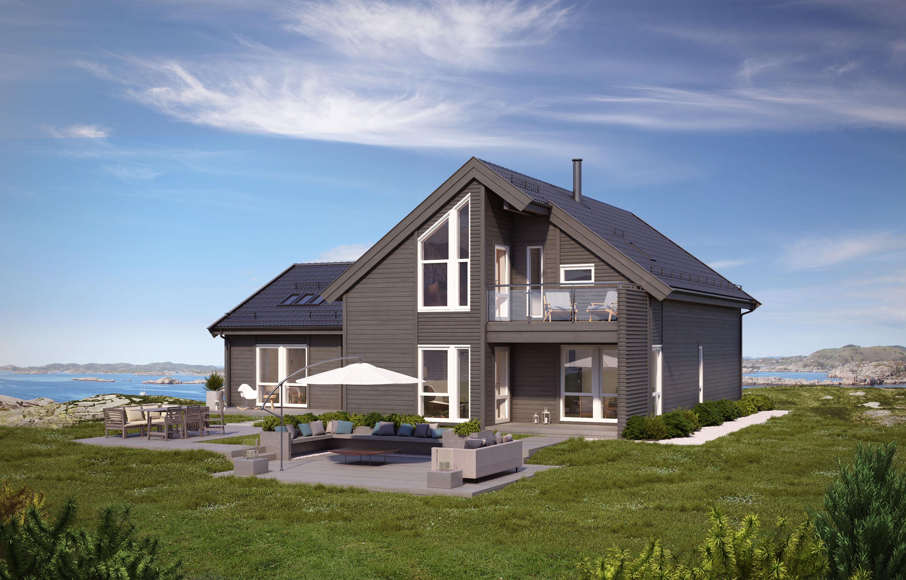 et grått hus på et gressområde.
