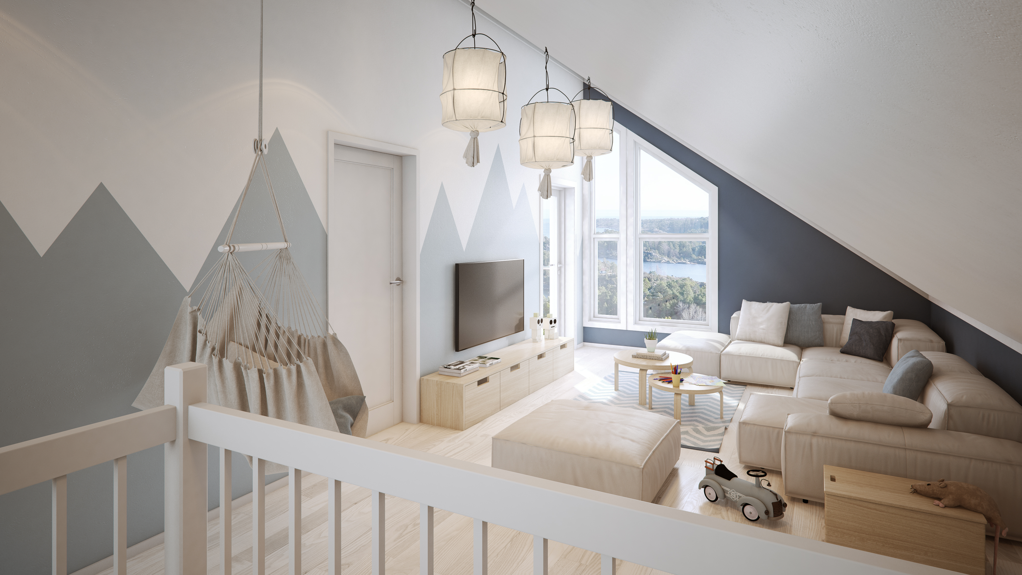 en stue på et loft med fjellutsikt.