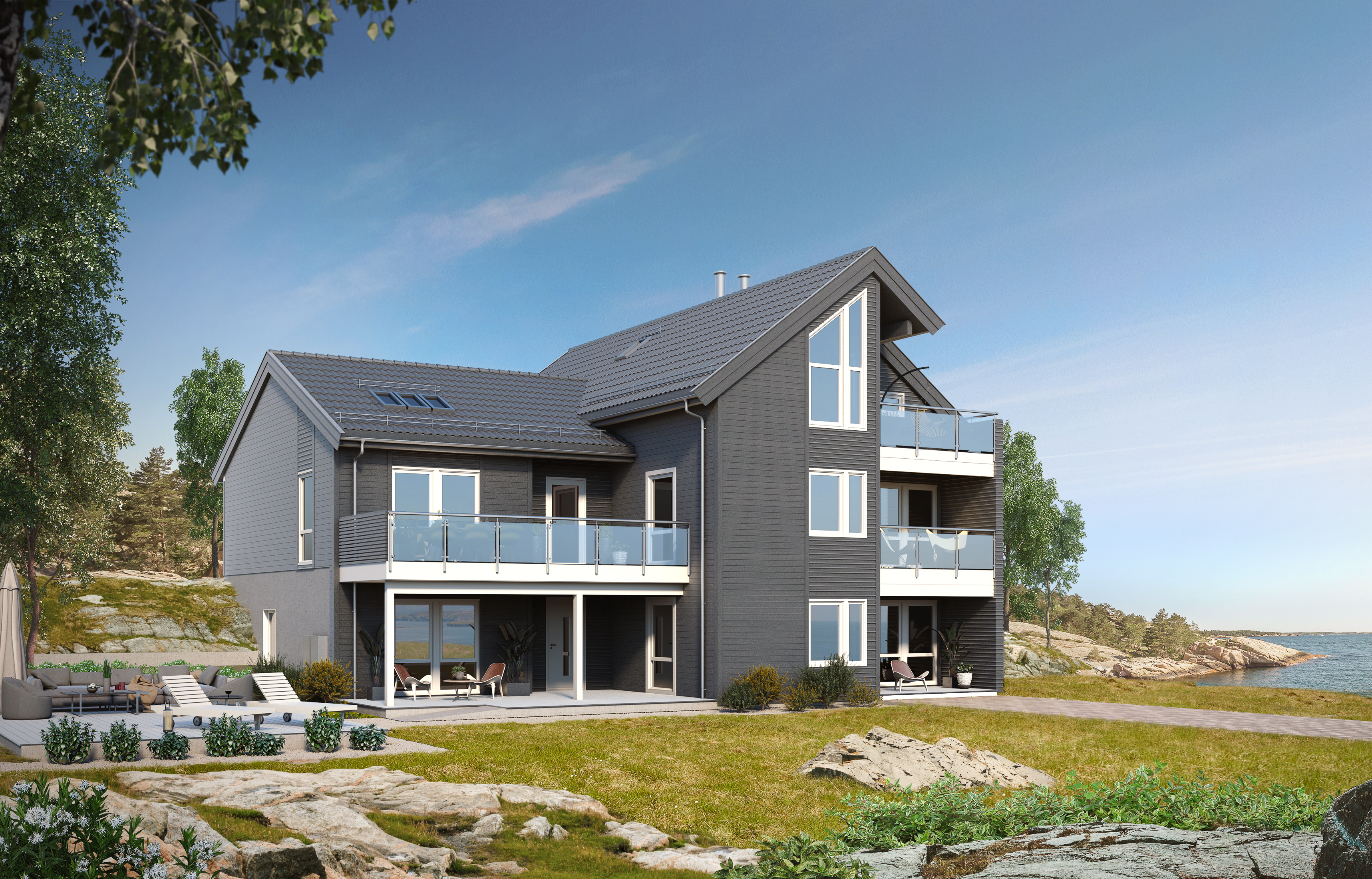 et hus på en høyde med utsikt over havet.