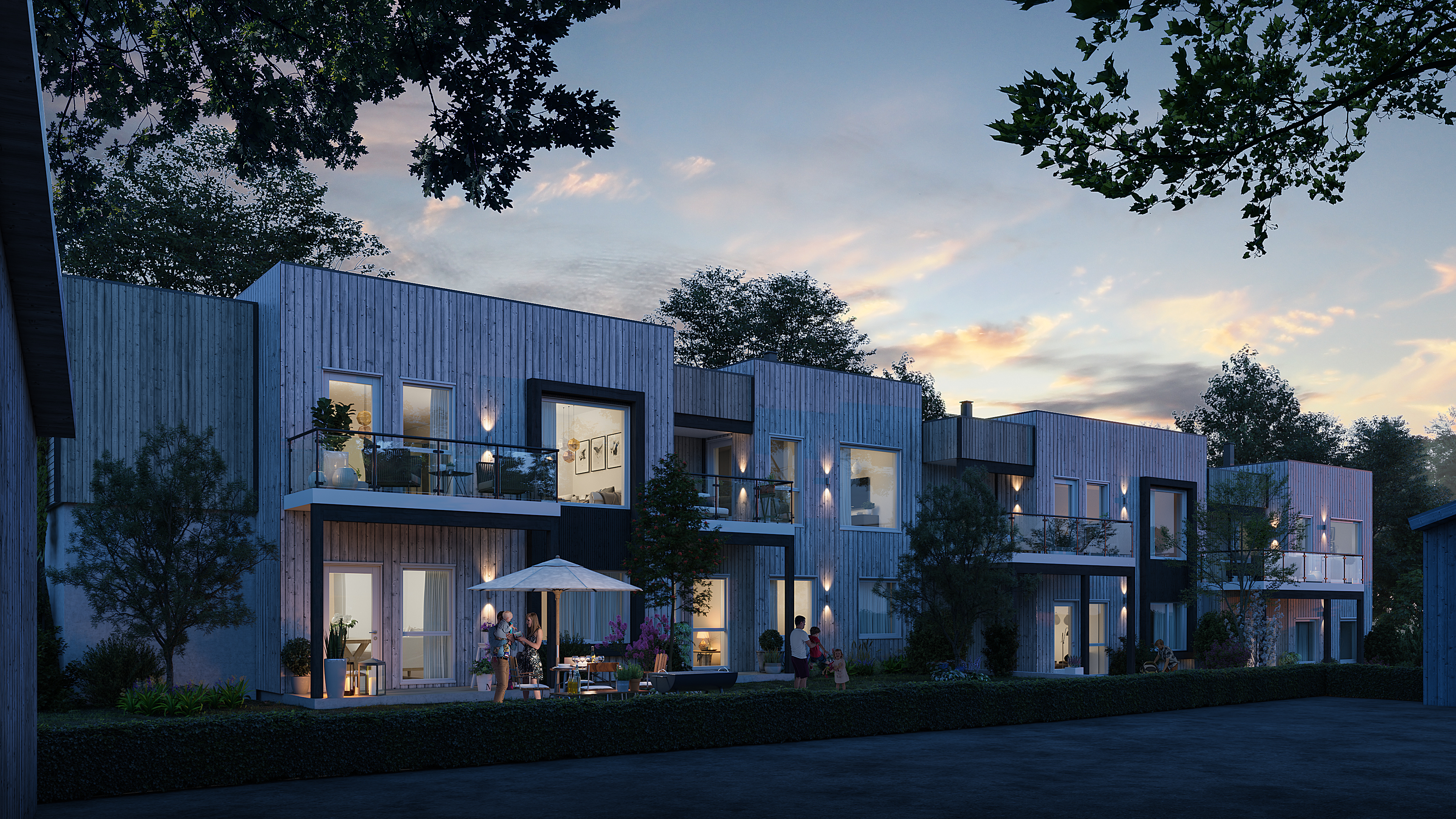 en gjengivelse av et moderne leilighetskompleks i skumringen.