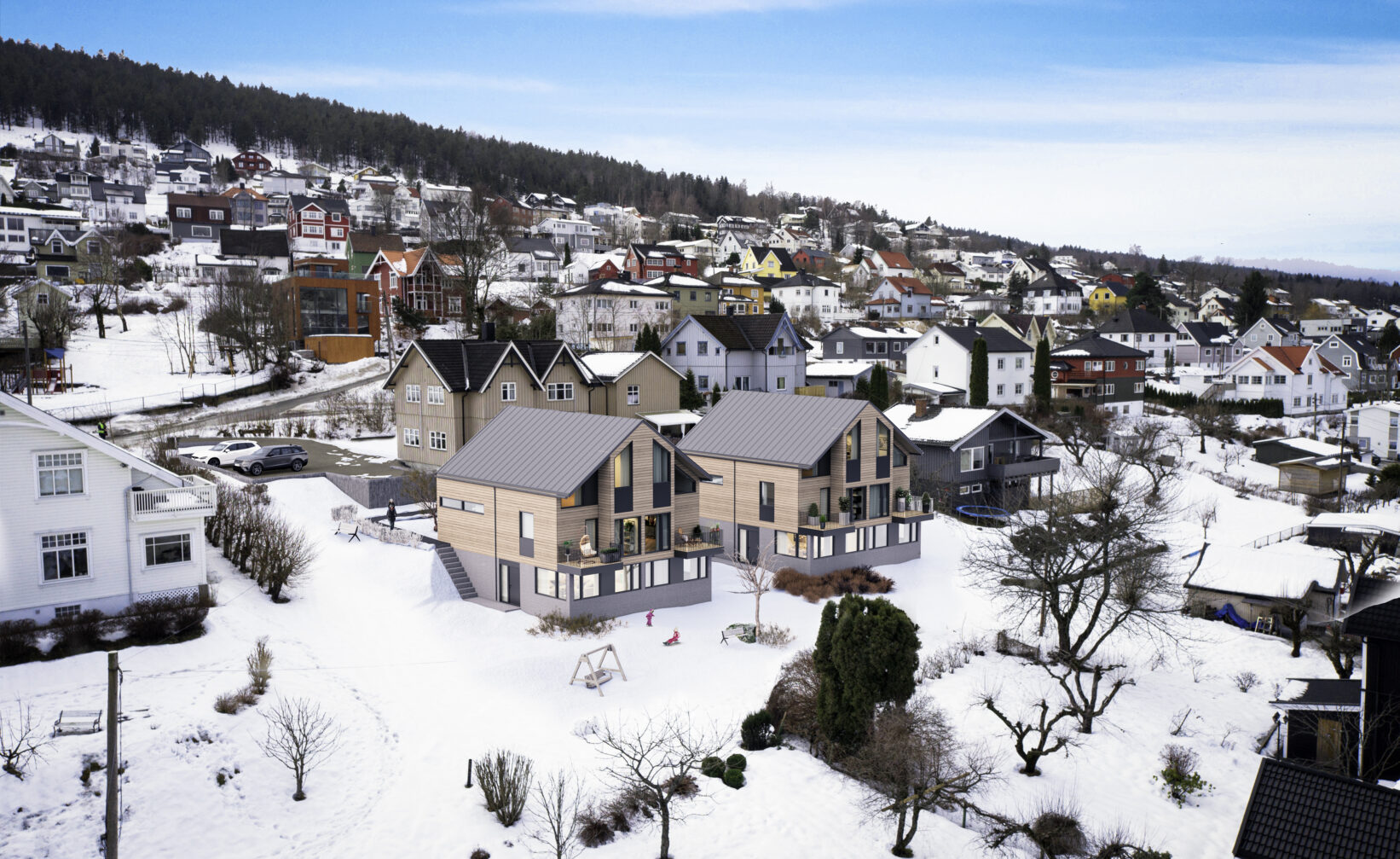en luftfoto av en by med snø på bakken.