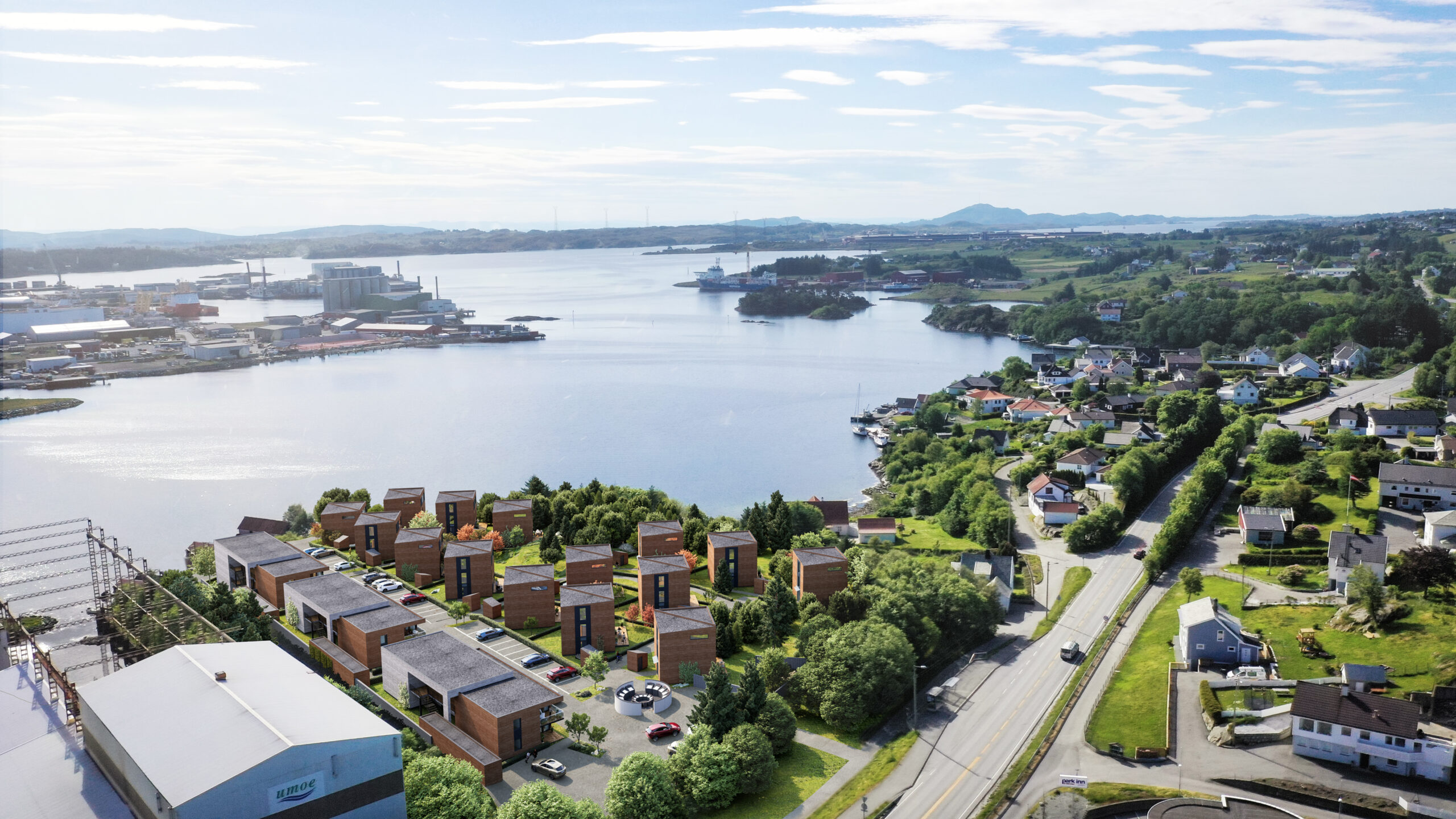 et luftfoto av en by nær en vannmasse.