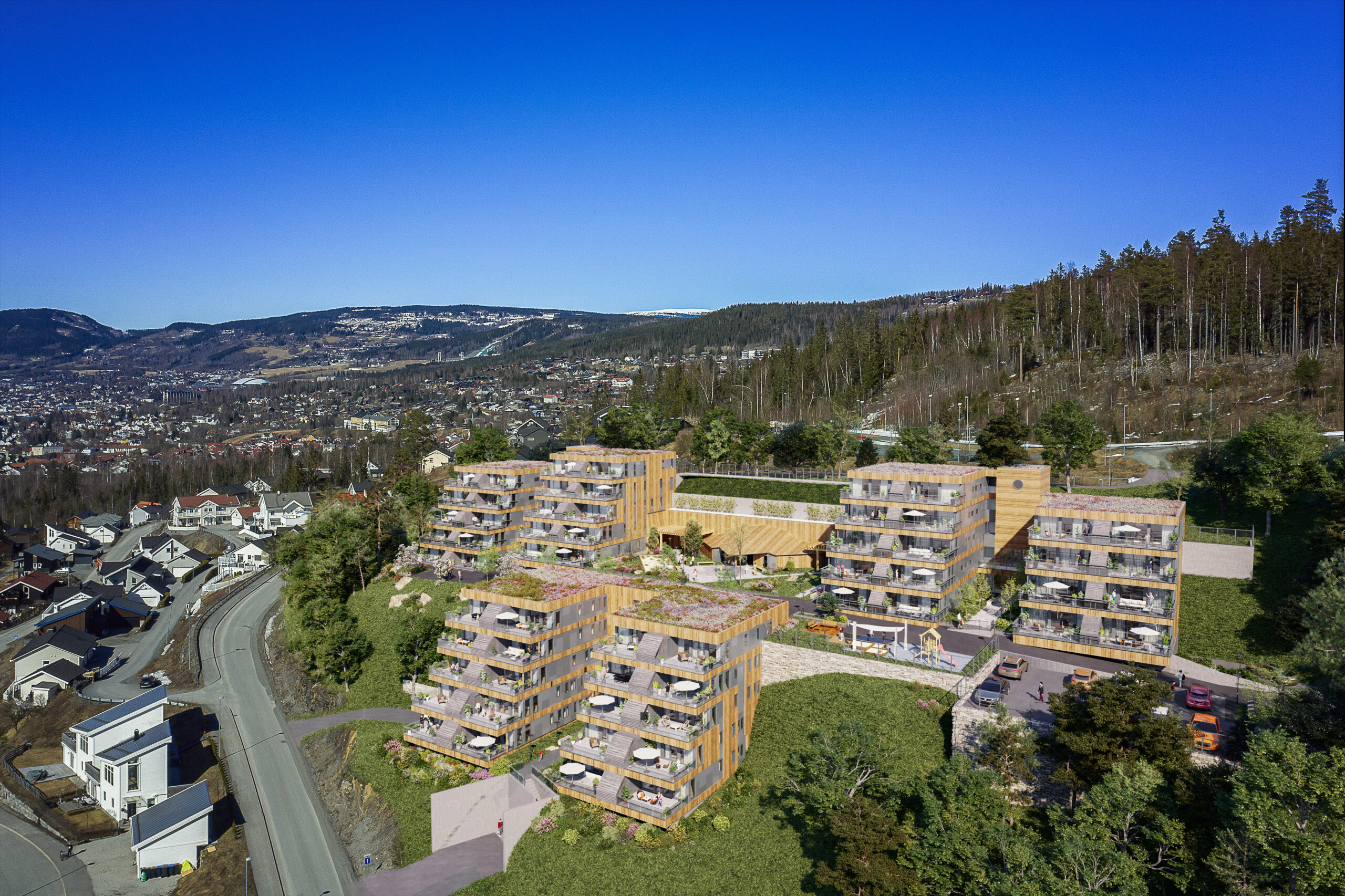 en luftfoto av et leilighetskompleks i fjellet.