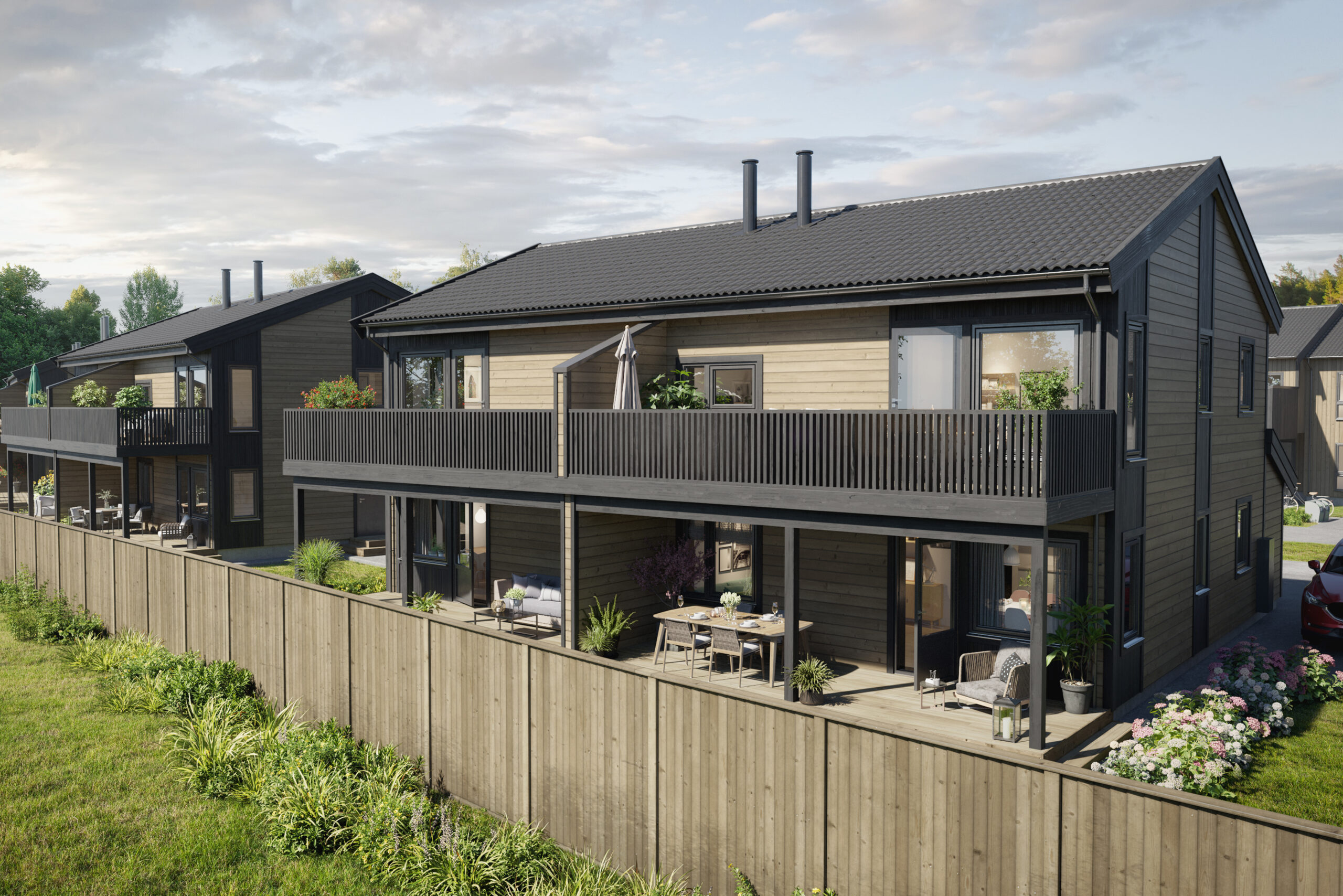 en 3d-gjengivelse av et hus med balkonger og et gjerde.