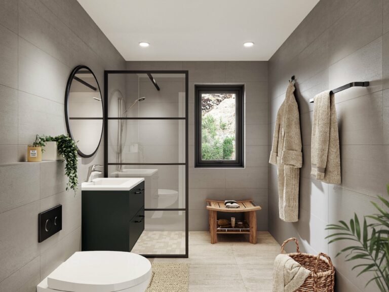 et moderne bad med toalett, vask og plante.