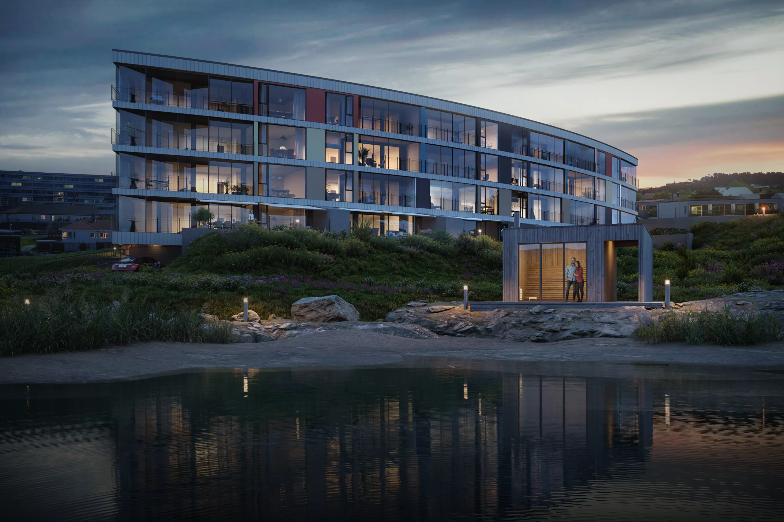 Eksteriør av stort bygg på kveldstid
