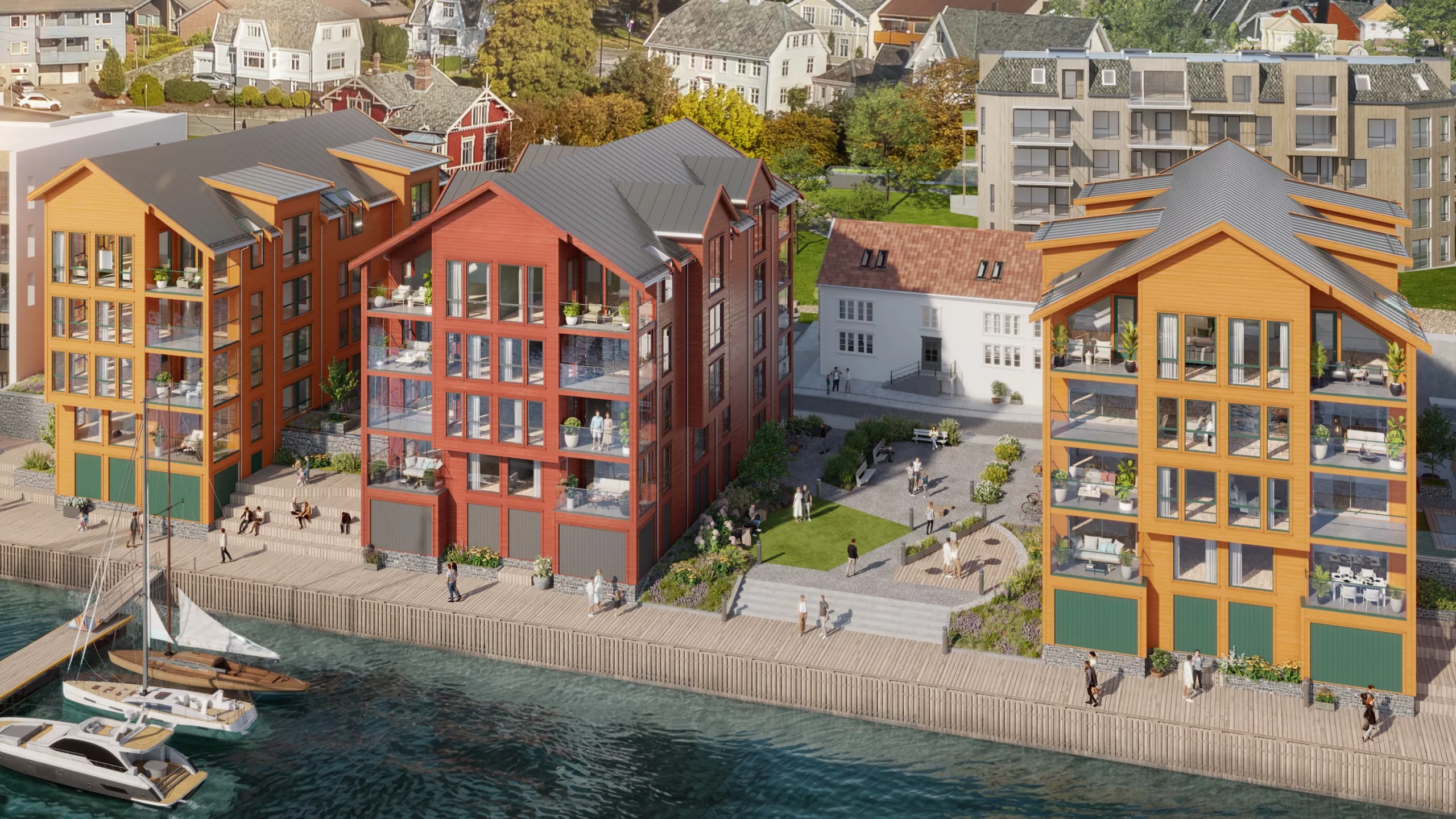 Moderne bygninger ved sjøen med balkonger langs en havn. Små båter ligger til kai i nærheten. Folk går langs promenaden.