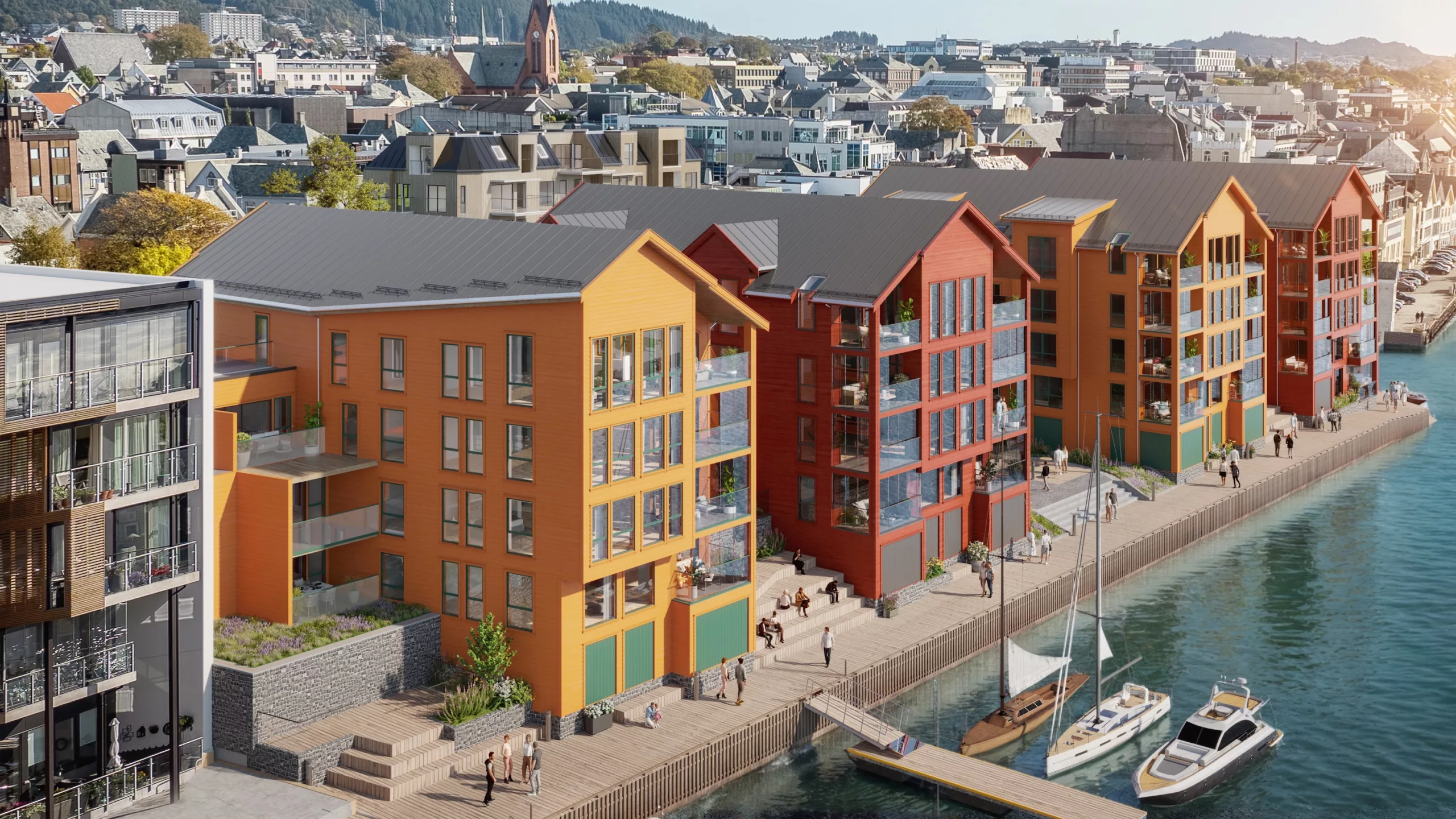 Fargerike, moderne bygninger ved vannkanten med store vinduer langs en kai, der folk rusler og båter ligger fortøyd. Urbant bybilde og skogkledde åser er synlige i bakgrunnen.